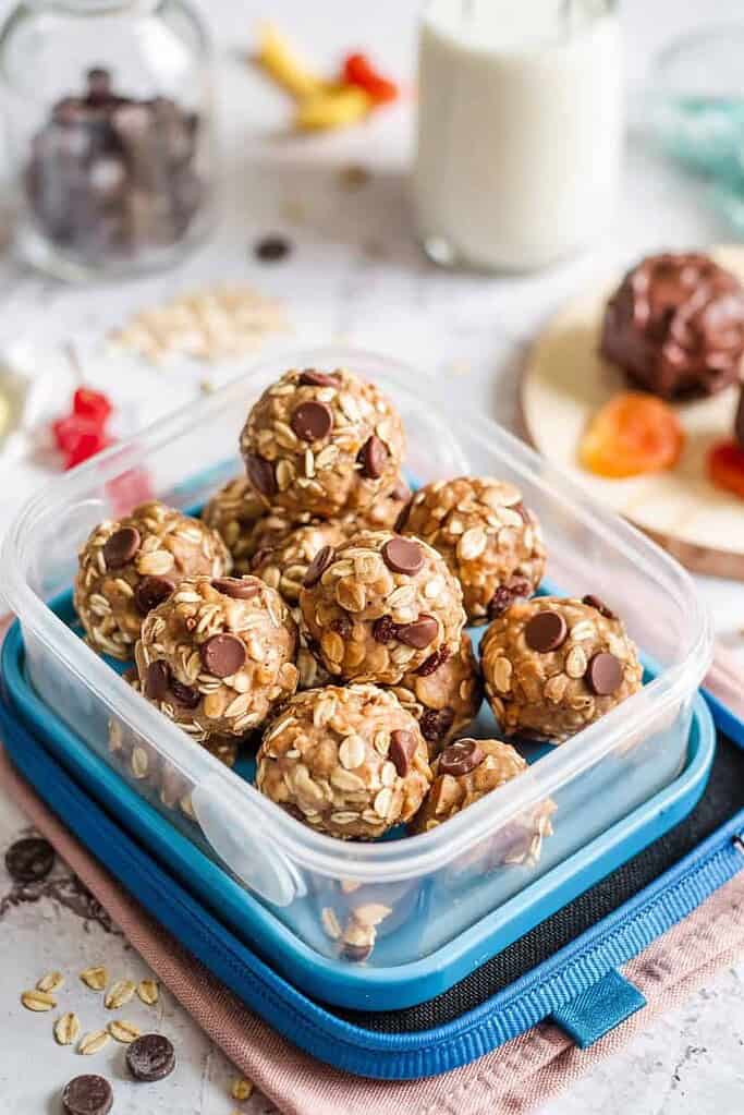 Delicious homemade oatmeal chocolate chip energy bites in a storage container.