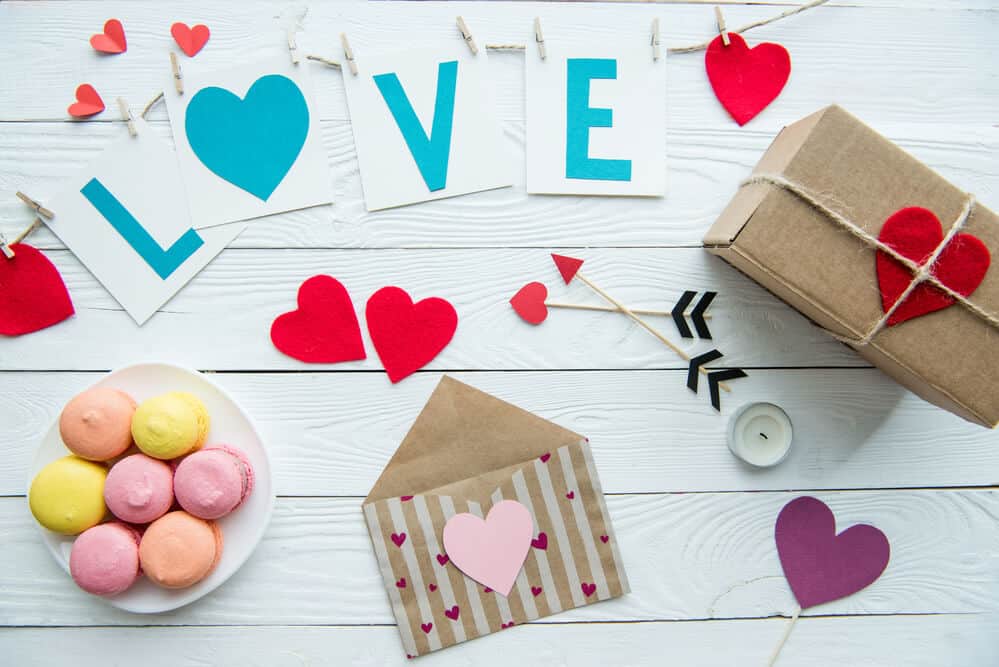 Valentine's Day background with envelopes decorated with hearts.
